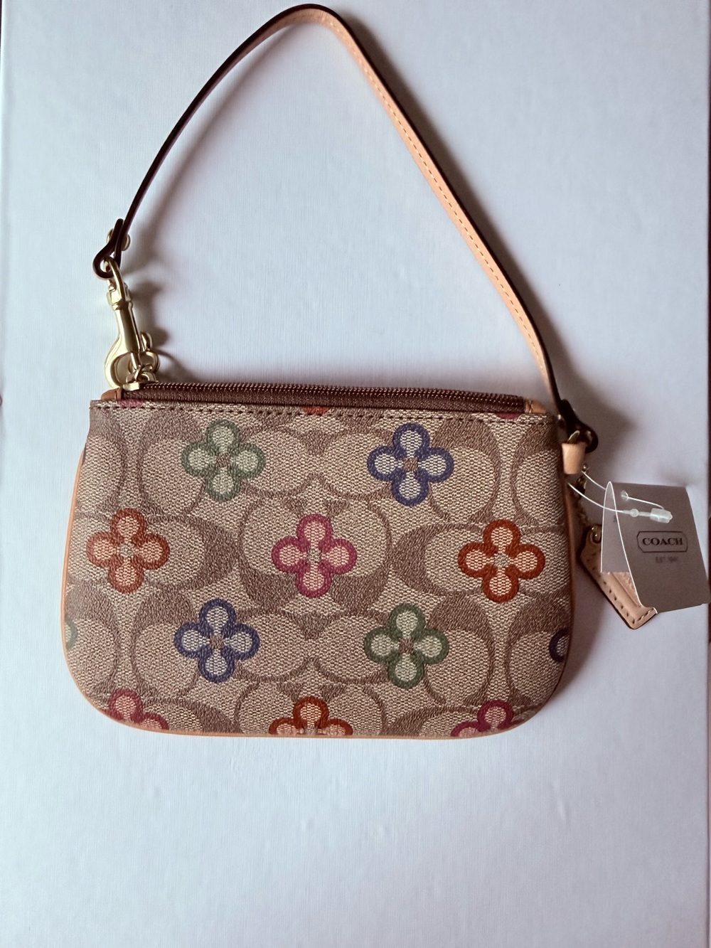 Coach Beige Signature Wristlet with Multicolor Floral Motifs